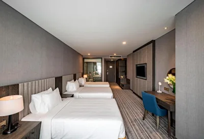 Deluxe Triple Room — Muong Thanh Luxury Saigon Hotel
